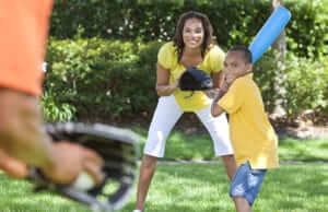 Family Playing Baseball in the Yard